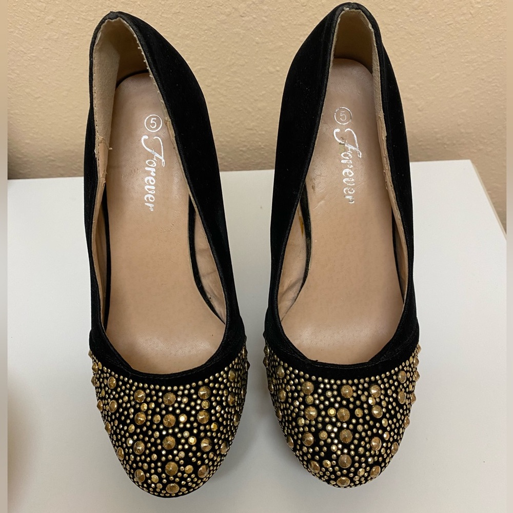 Size 5 Black Wedge type faux suede heels with gold beads.